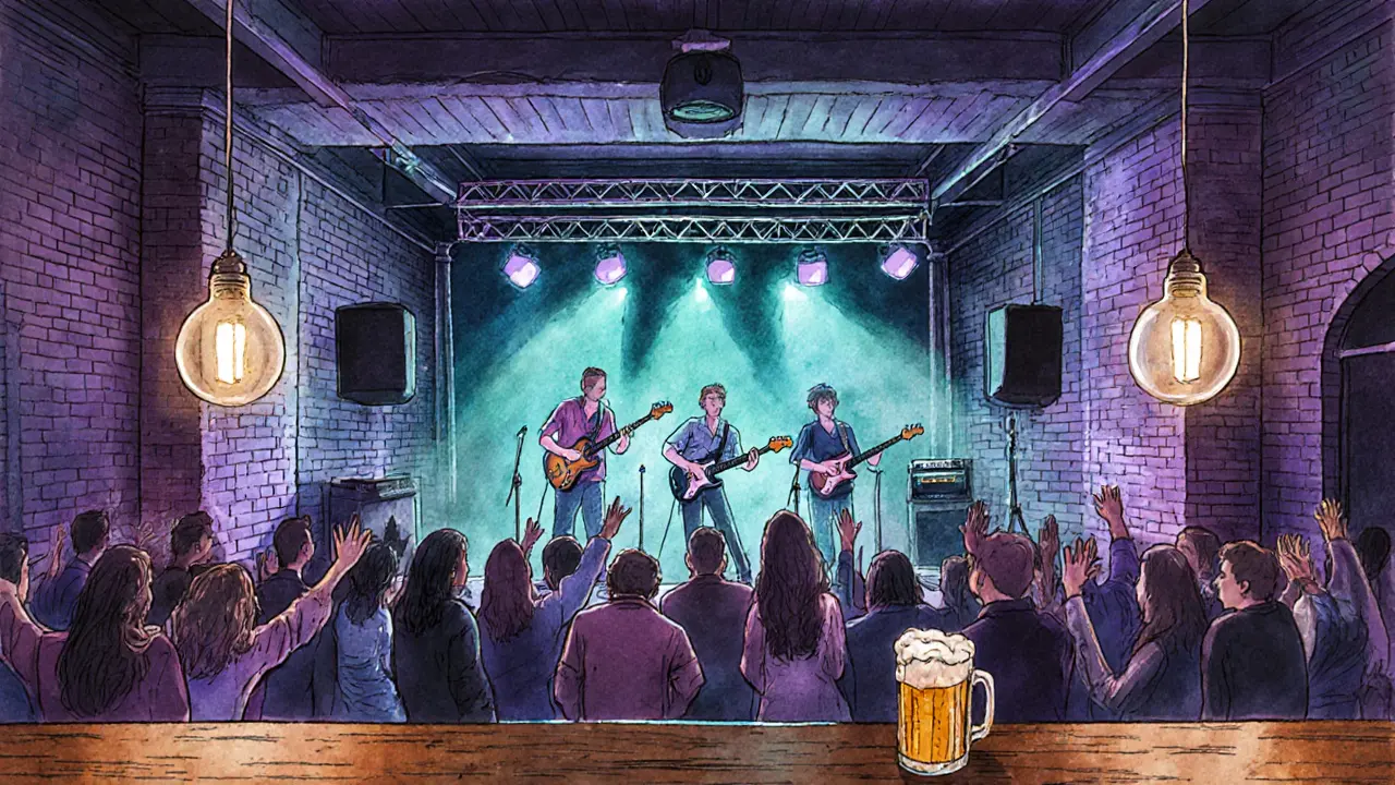 Indie concert inside Glazart showing stage, crowd, and bar in teal lighting.