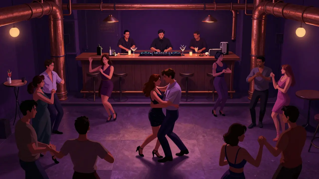 Dancers moving freely on Glazart's main floor at midnight, a DJ and percussionist performing live amid exposed brick and copper pipes.